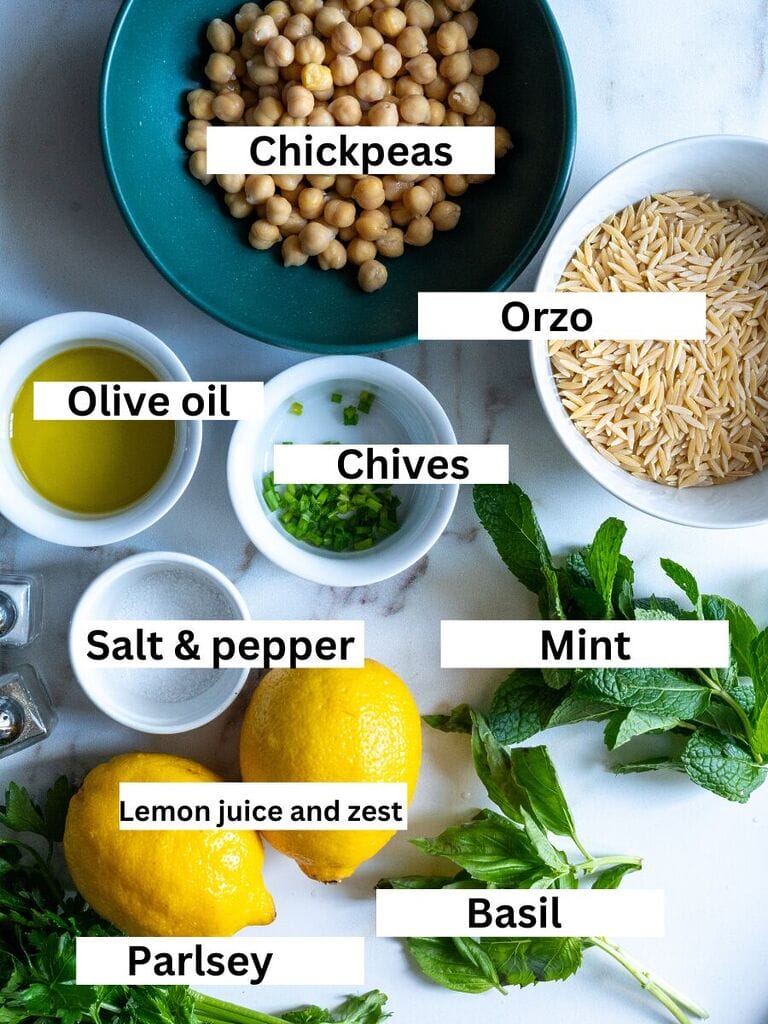 Ingredients for herbed orzo with chickpeas which include: chickpeas, olive oil, orzo, chives, mint, basil, parsley, lemon juice and zest, salt and pepper.