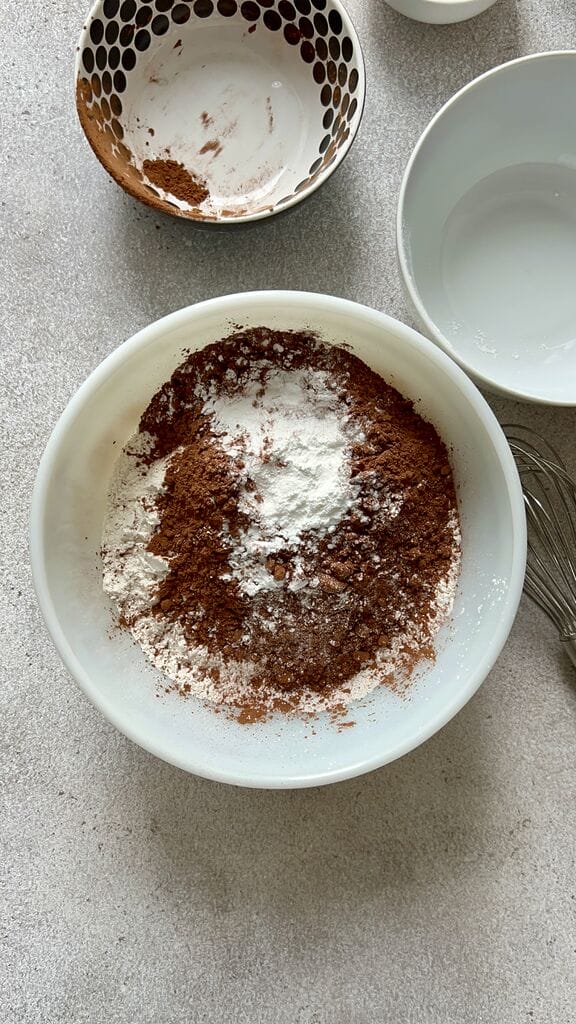 Combining the flour and cocoa powder.