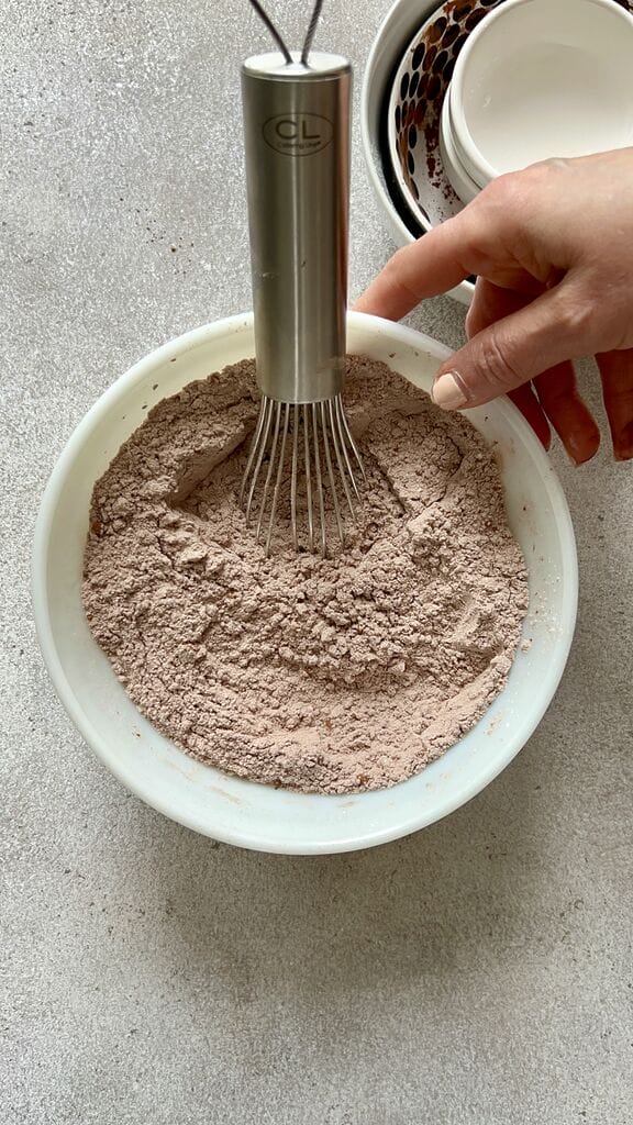 Combining the flour and cocoa powder.