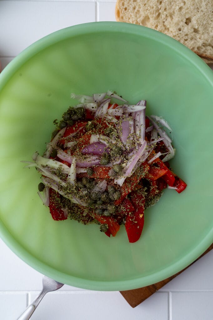 Mixing the ingredients together in a green pyrex bowl.