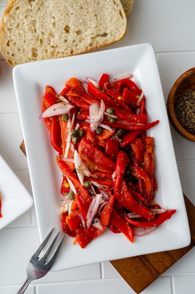 Roasted red pepper salad on a white plate.