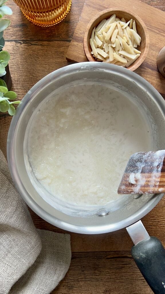 Cooking the rice in a stainless steel pot.