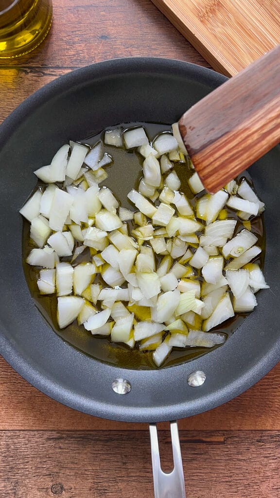 Frying the onions in the olive oil.