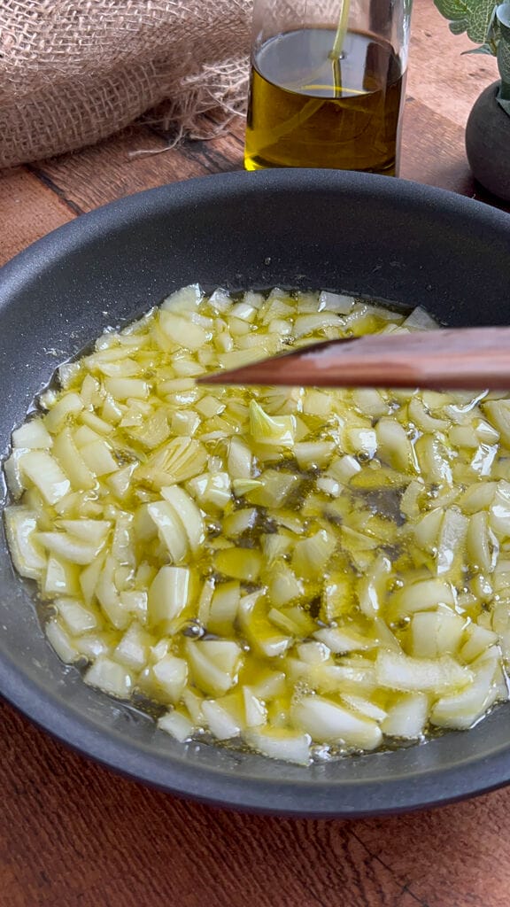 Frying the onions in olive oil.