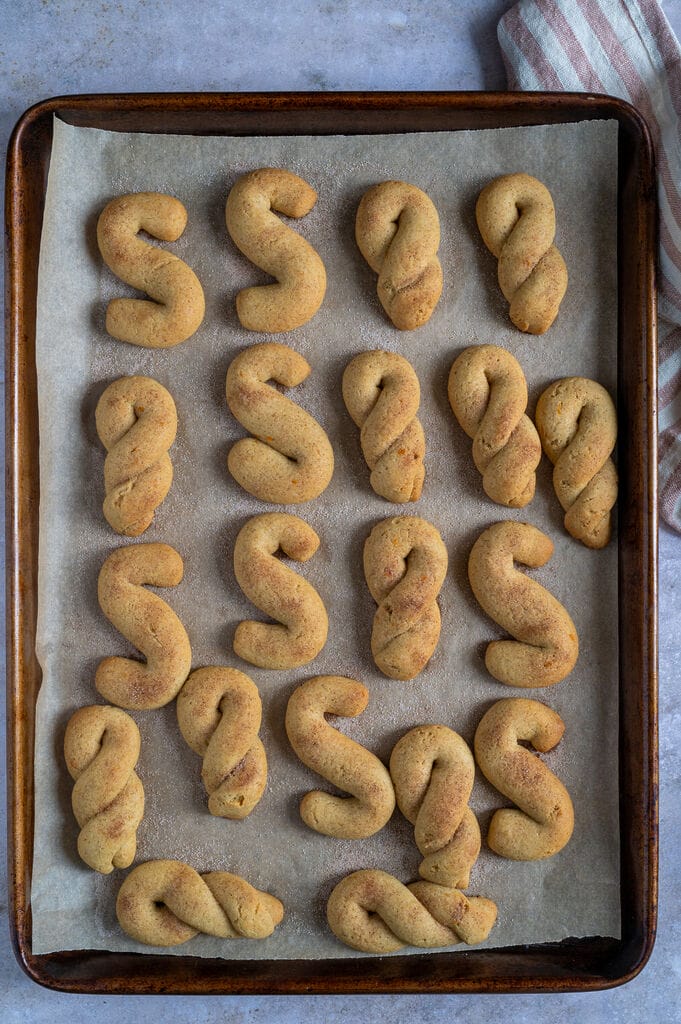 Cookies fresh out of the oven on a baking sheet.