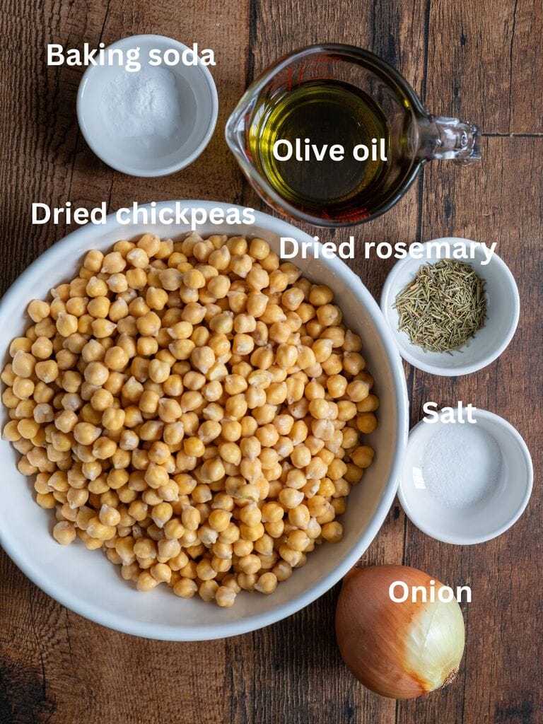 Ingredients for Baked chickpeas which include: Dry chickpeas; baking soda, olive oil, dried rosemary, salt and onion.