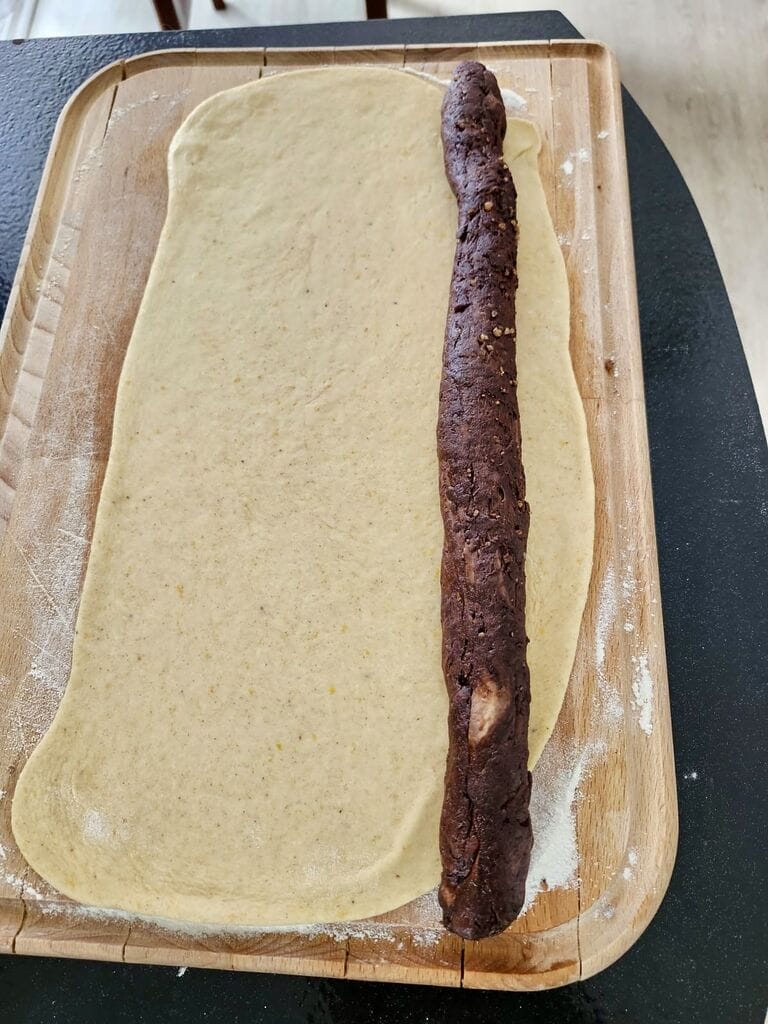 rolling the chocolate and white dough together.