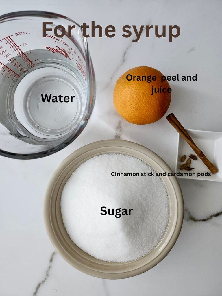 Ingredients for the syrup, which include: Water, sugar, orange peel and juice; cinnamon stick and cardamon pods.