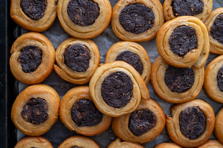 Roxakia cookies shown on a baking sheet.