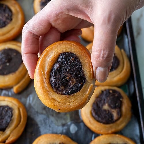 Holding up a Roxakia cookie.