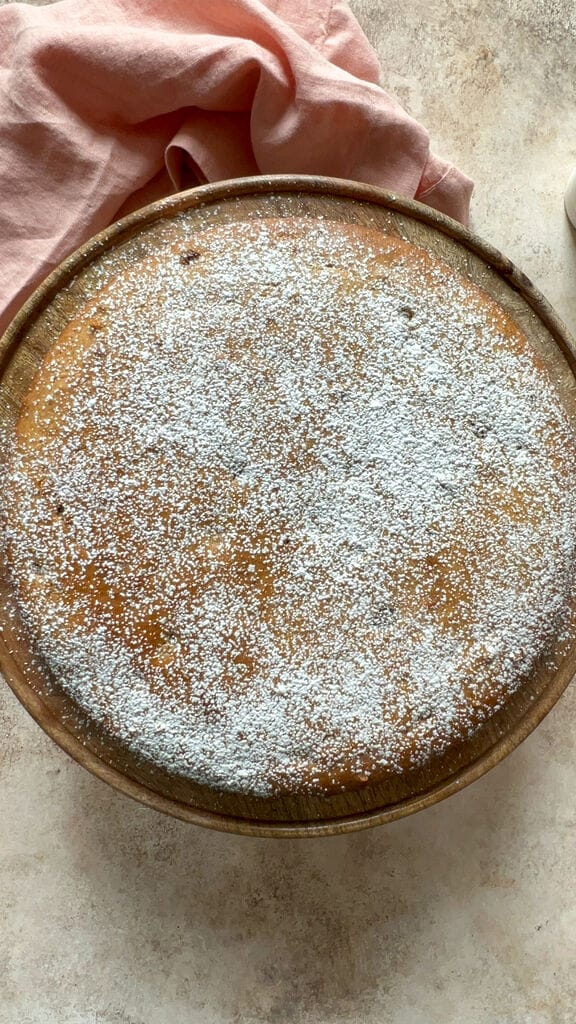 Phanouropita or Fanouropita on a serving platter sprinkled with icing sugar.