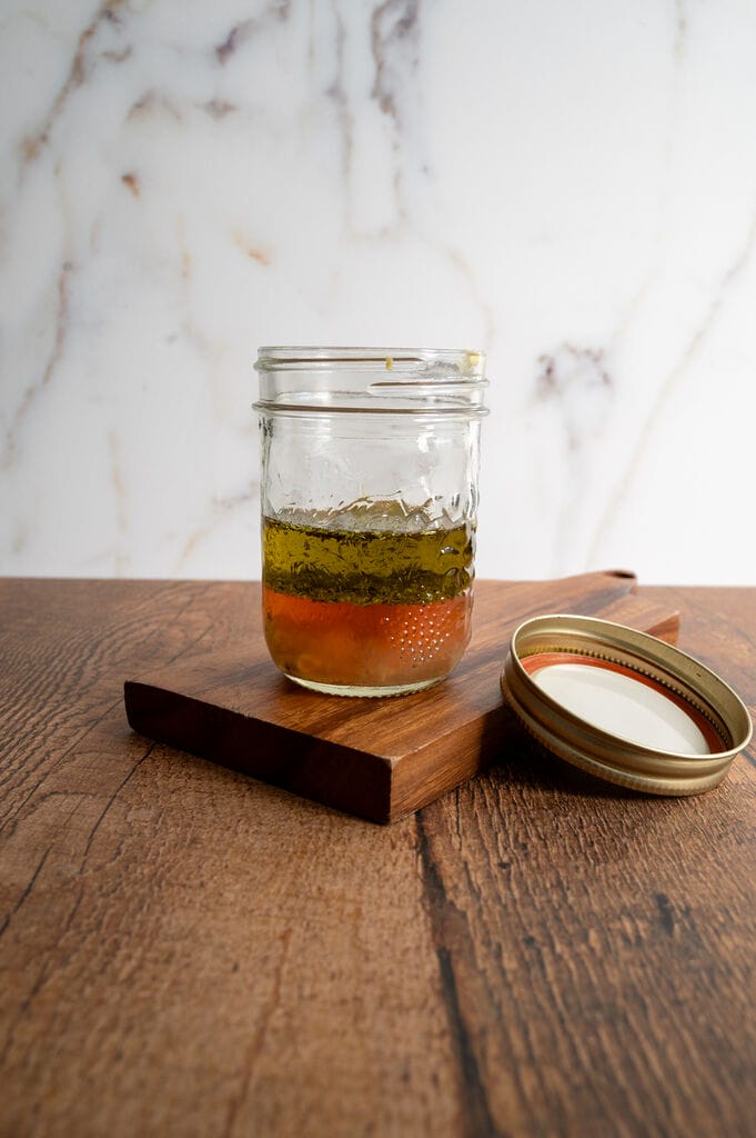 Greek salad dressing in a mason jar.