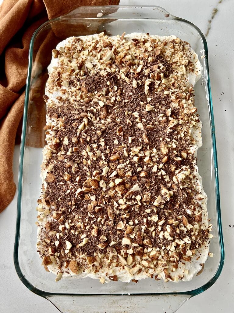 Finish by Topping with almonds, and shaved chocolate.