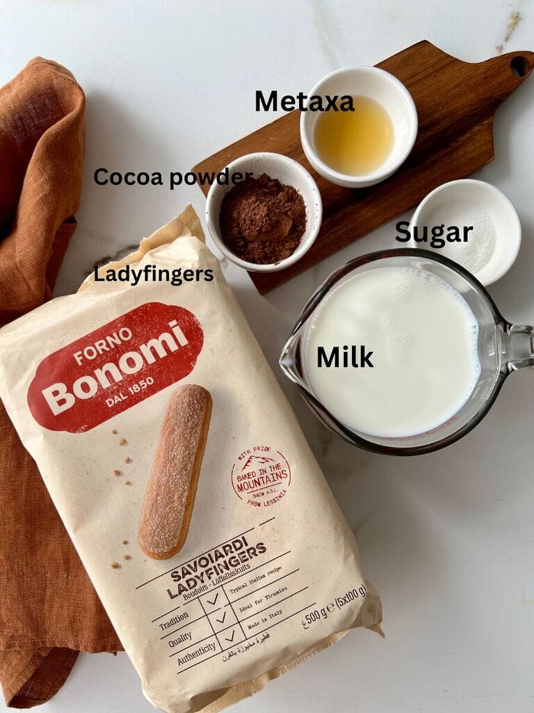 Ingredients for ladyfingers: Ladyfingers, cocoa powder, metaxa, sugar and milk.