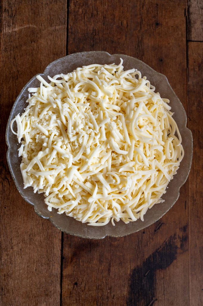 The grated mozzarella cheese.