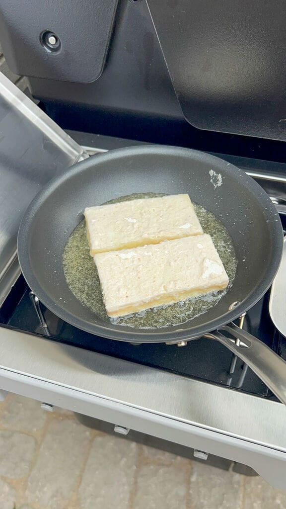 Frying the cheese saganaki.