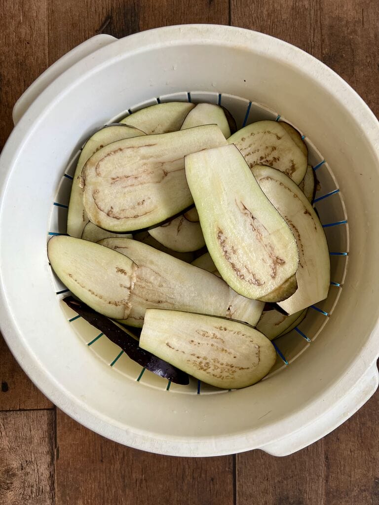 Draining the eggplant.