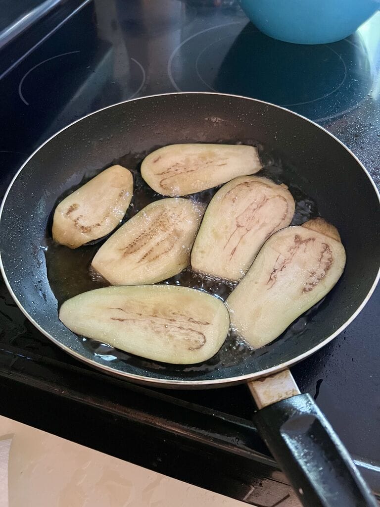 Frying the eggplant.