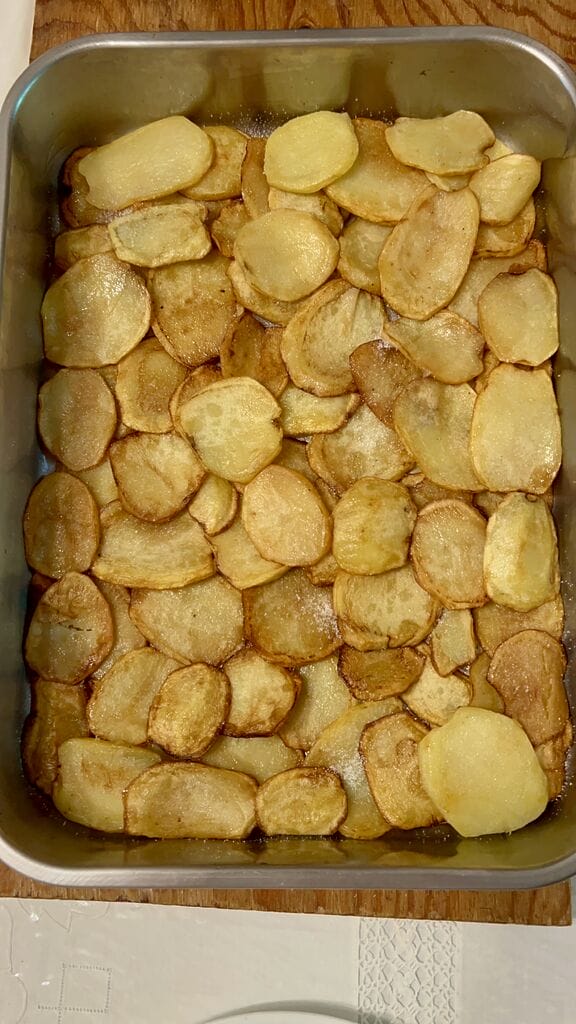 Layering the potatoes.