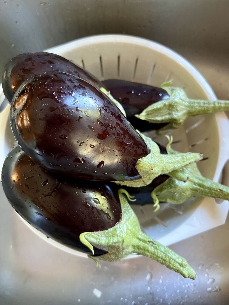 Washed eggplants.