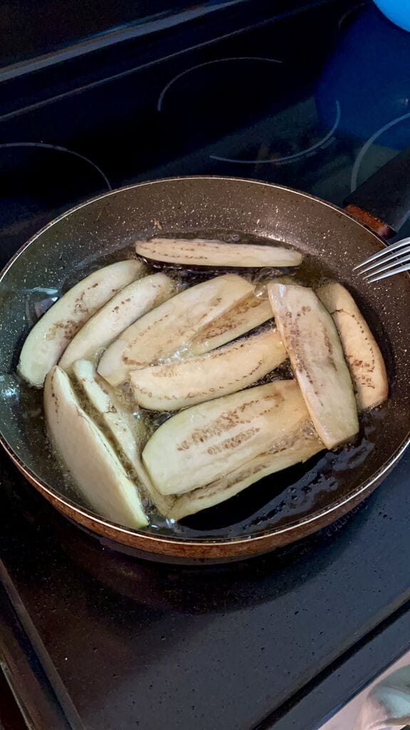 Frying the eggplant.