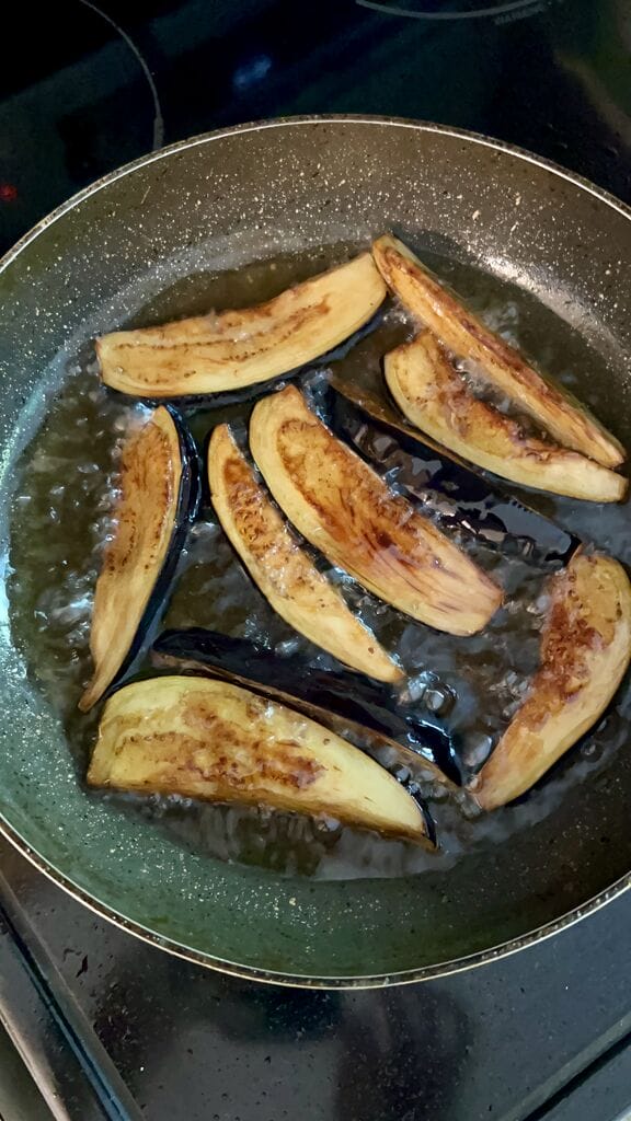 Frying the eggplant.