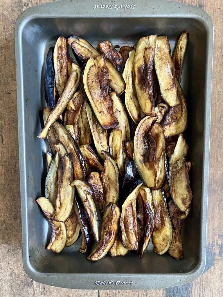 Layering the eggplant in the baking pan.