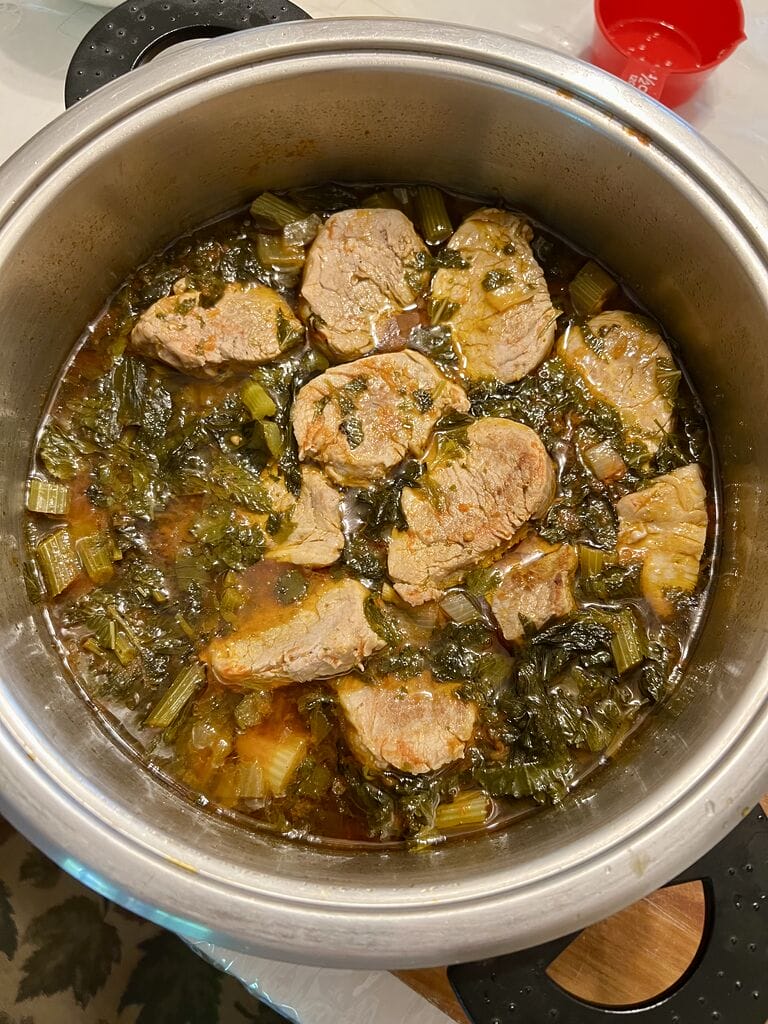 Adding the pork pieces to the celery