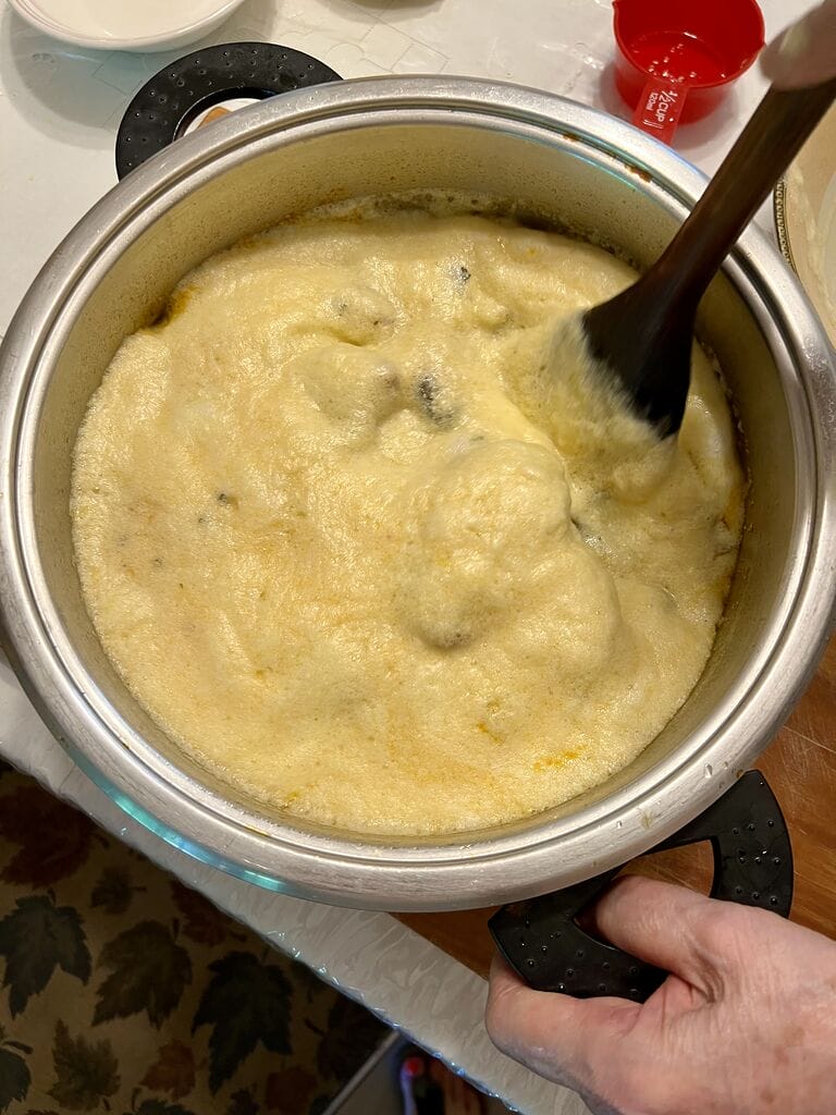 Stirring in the egg lemon sauce
