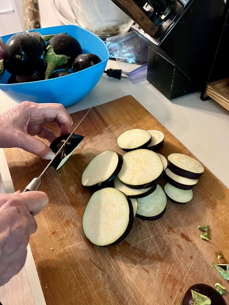 Slicing the eggplant.