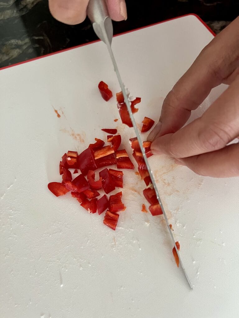Chopping the red chili pepper