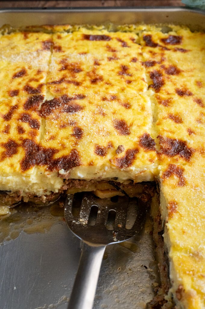 Moussaka in a stainless steel pan.