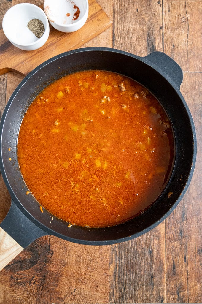 Adding the tomato sauce.