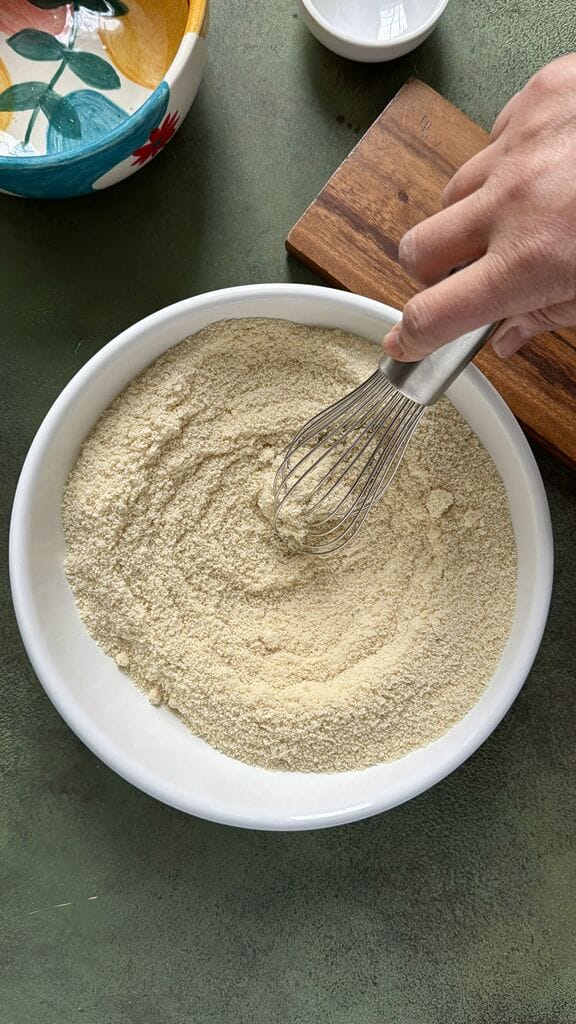 Mixing in the salt to the almond flour.