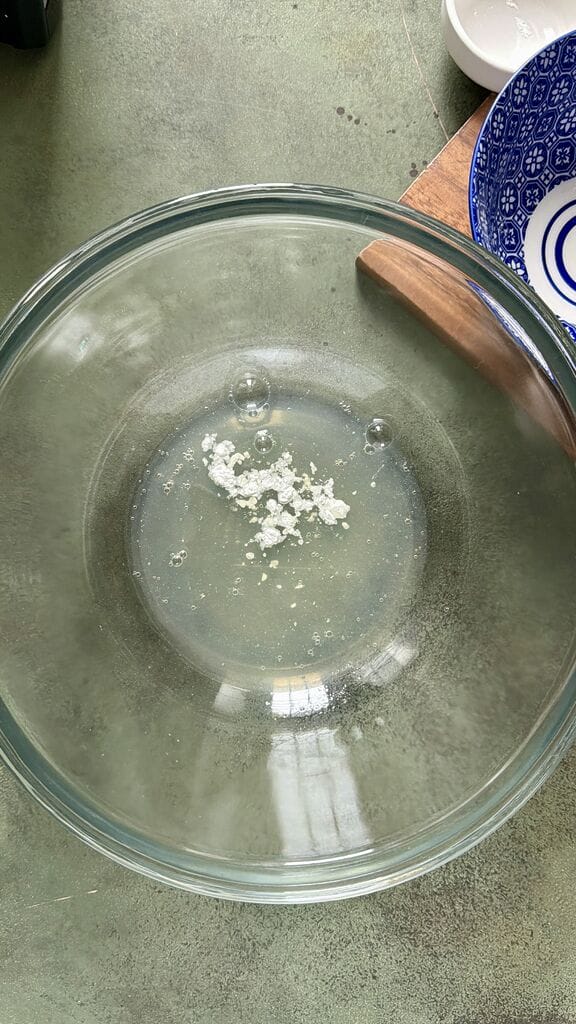 Add the cream of tartar to the egg whites.