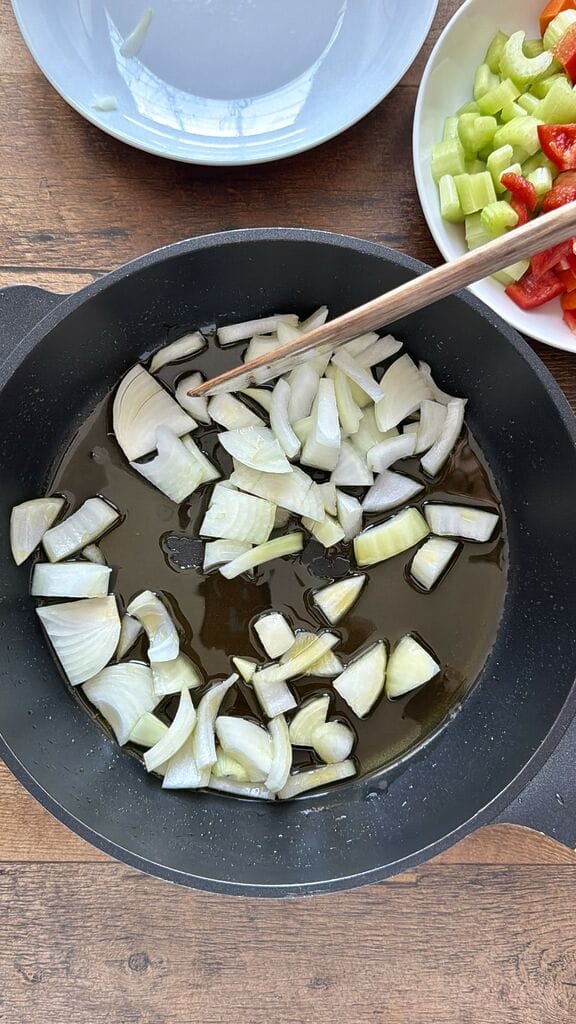 Sautéing the onion in olive oil.