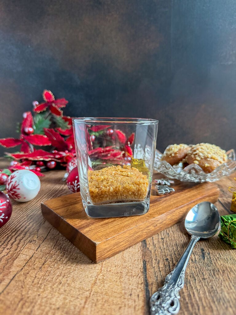 Layering the bottom of the tumbler with crushed up melomakarona.