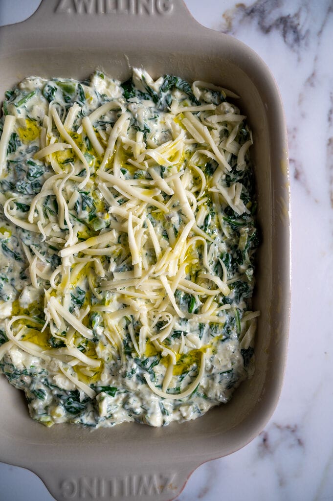 The spananakopita dip is assembled and ready to bake.