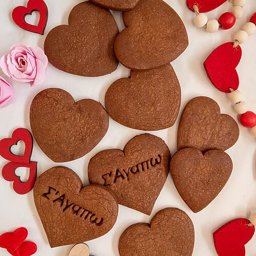 Chocolate cutout cookies on a white background.