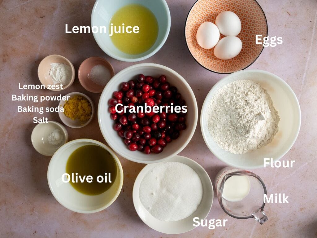 Ingredients which include: Cranberries, Flour, Olive oil, Sugar, Eggs, Milk, Lemon juice, Lemon Zest, Baking powder, Baking soda, and Salt.