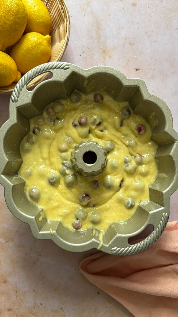 Adding the batter in the cake pan.