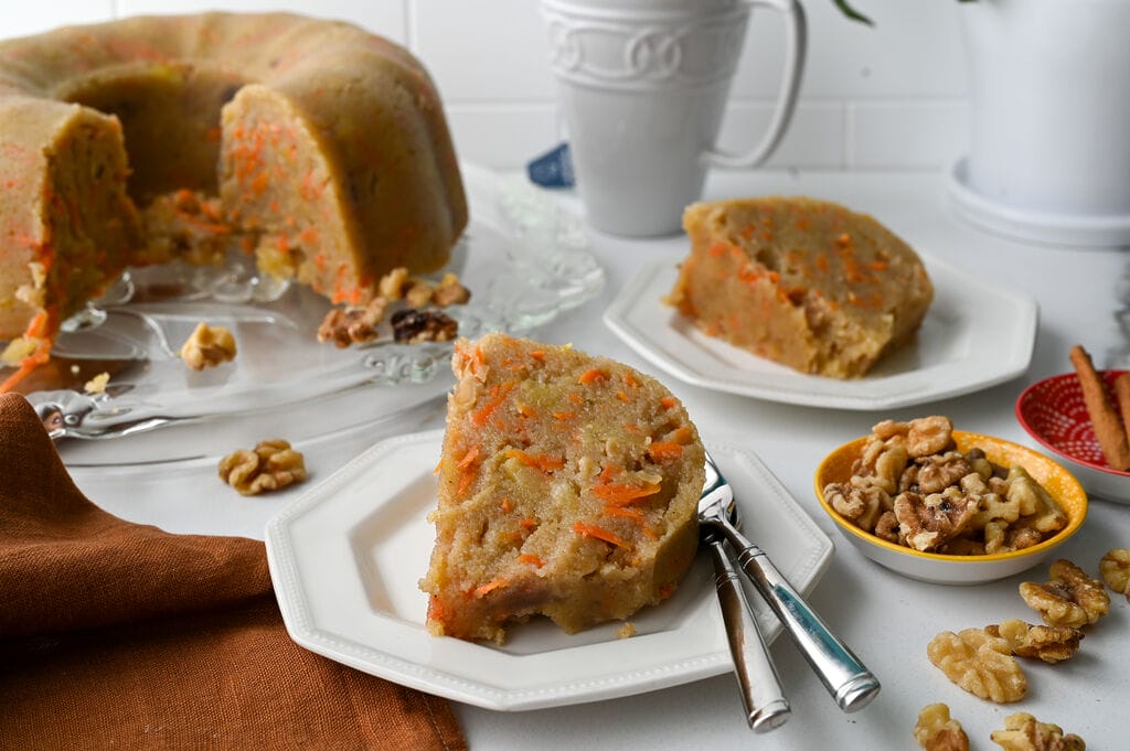A piece of the Greek carrot cake semolina halva on a white plate.