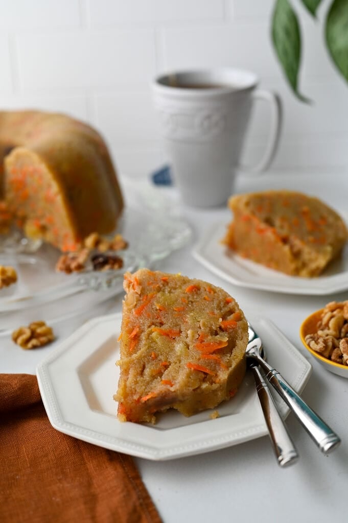 A piece of the Greek carrot cake semolina halva on a white plate.