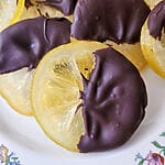 Candied lemon slices half dipped in dark chocolate.
