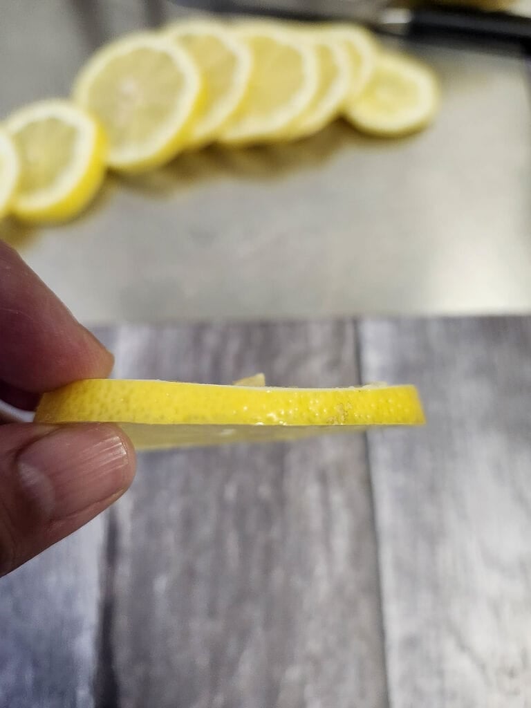 Showing how thin the lemon slices should be.