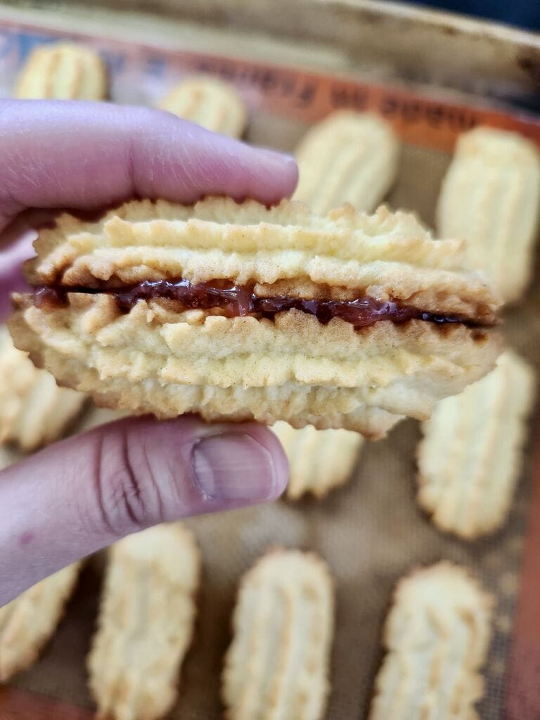 Putting the 2 cookies slices together.
