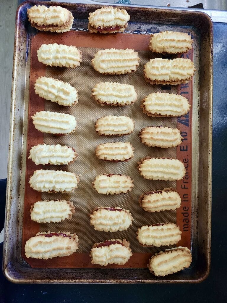 Baked cookies and stuffed with jam.
