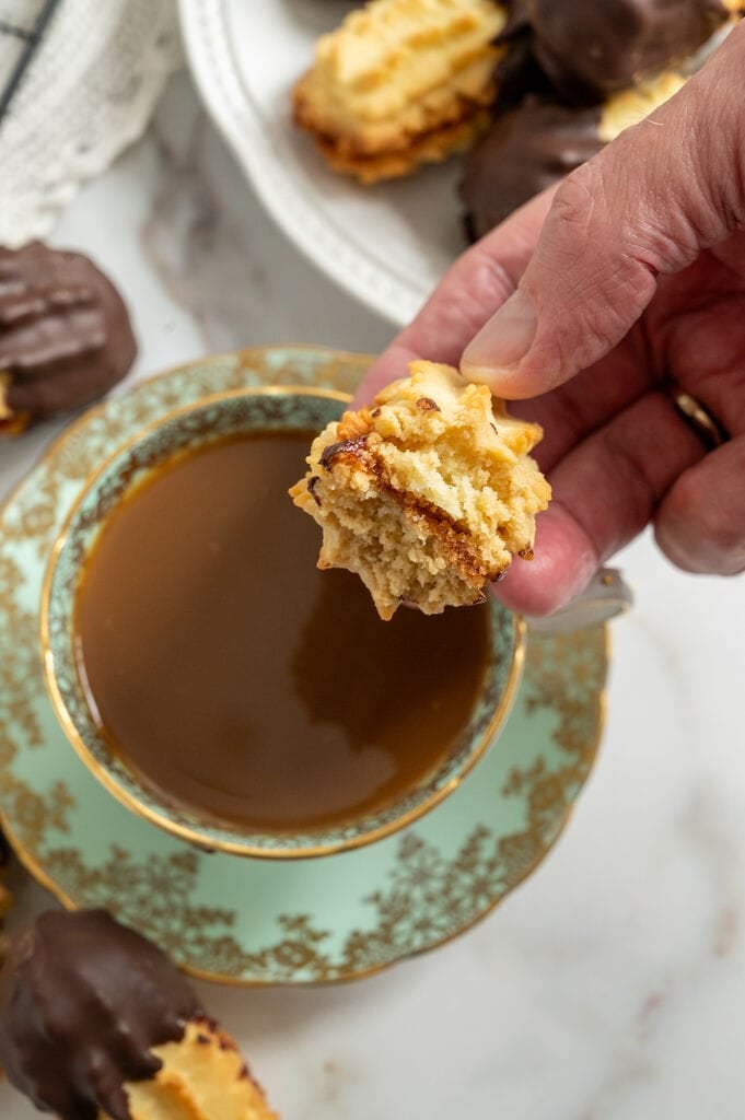 Dipping the cookie in coffee.