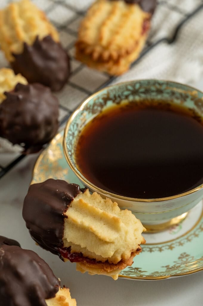 A cookie on a coffee dish.