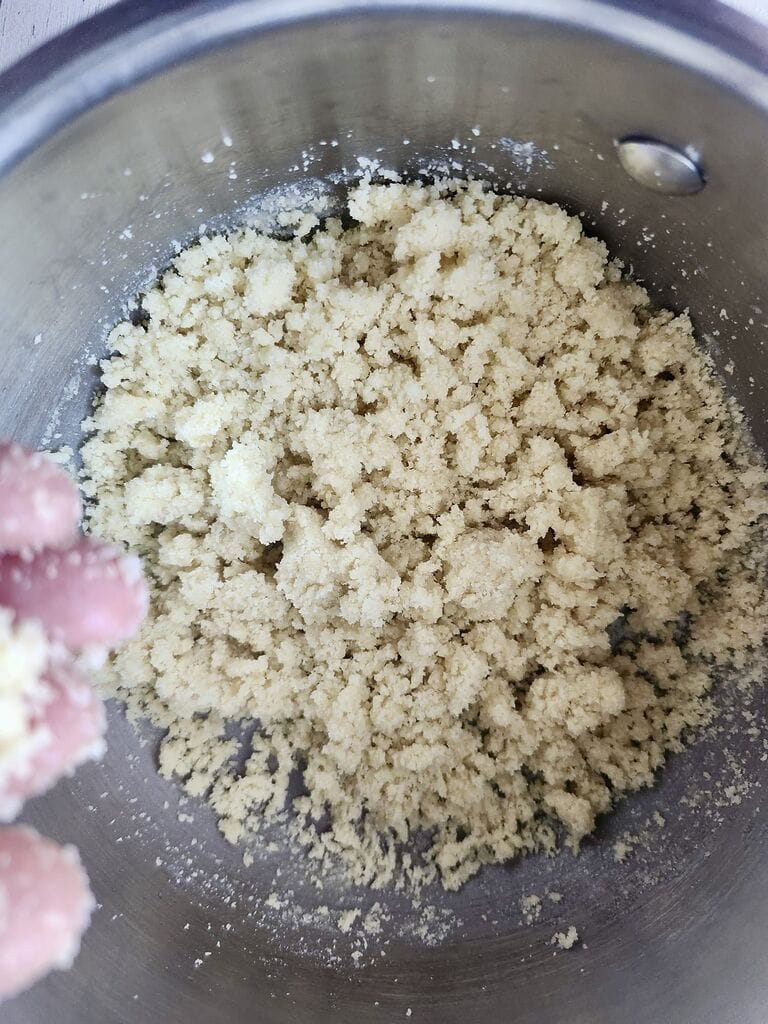 Combining the syrup with the almond flour.